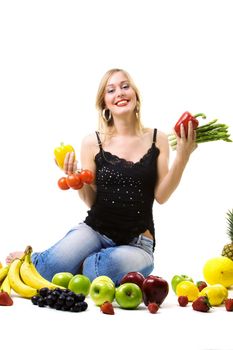 Young blonde woman with fruits and vegetables