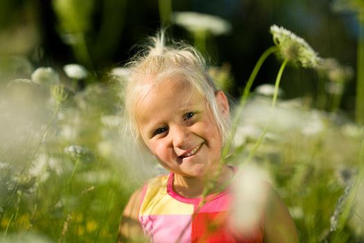 cute young girl in a field of yarrow