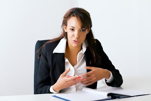 Female office worker gesturing