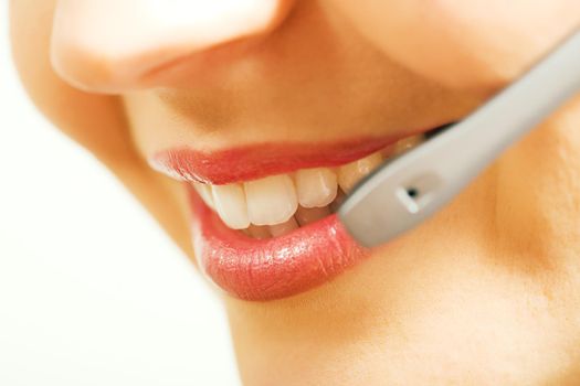 Close-up (mouth) of a friendly female call center operator