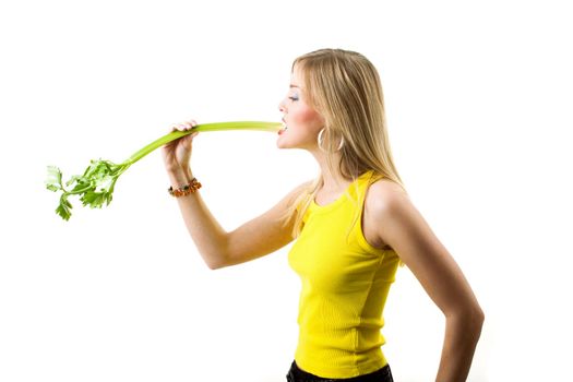 Food and healthy nutrition - Young beauty having some celery
