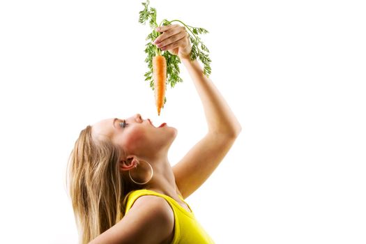 Food and healthy nutrition - Girl in yellow eating a carrot