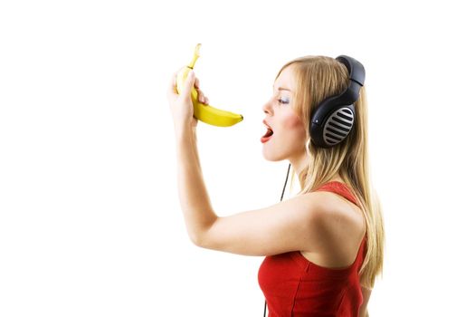 Woman singing into a banana