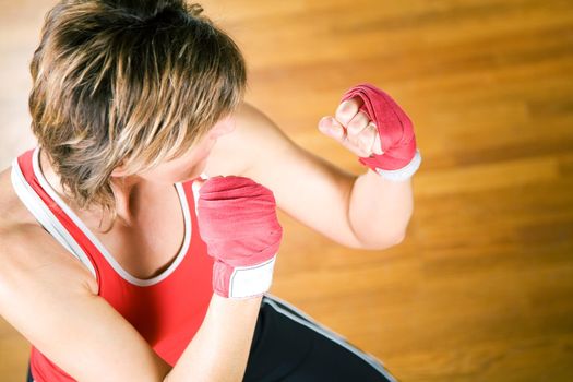 Sparring session in martial arts moves, couple exercising