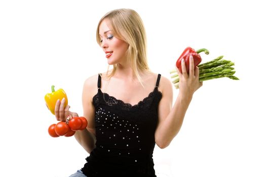 good looking girl holding diverse vegetables