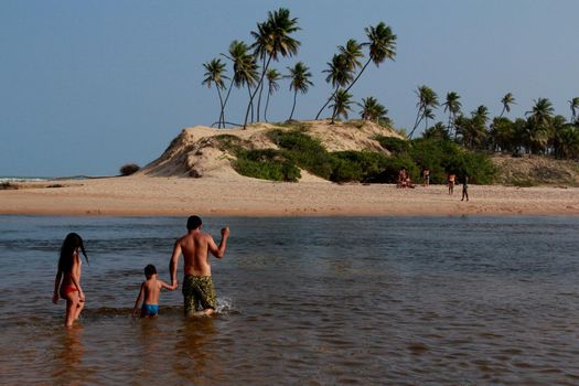 conder, bahia / brazil - september 9, 2012: Young man is seen at Barra do Itariri beach in the municipality of Conde, north coast of Bahia.

