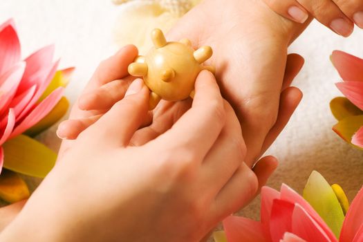 Woman getting a hand massage (close up on hands)