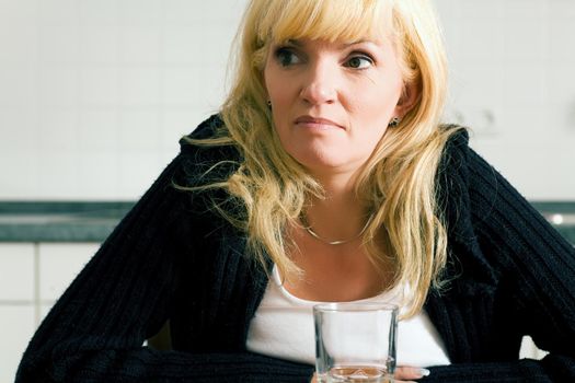 Woman with hangover looking agonized