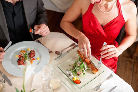 High angle view of couple having food at a restaurant