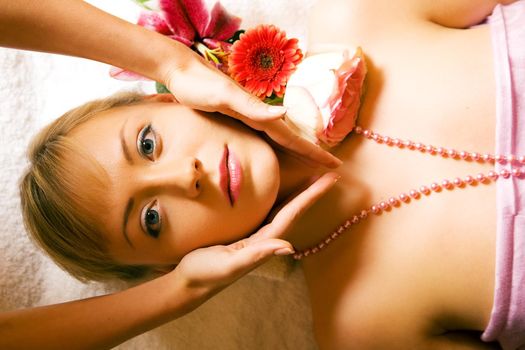 Beautiful woman enjoying a head massage