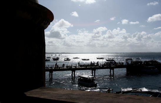 cairu, bahia / brazil - november 14, 2013: tourists are seen during embarkation and disembarkation at the port of the island of Morro de Sao Paulo, in the municipality of Cairu.