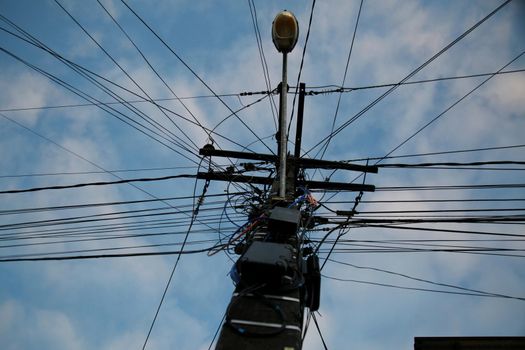 mata de sao joao, bahia / brazil - november 10, 2020: wiring is seen on a street lamp in the city of Mata de Sao Joao.