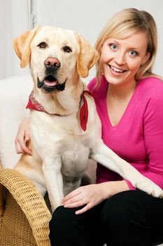 Labrador Retriever and his mom looking into the camera