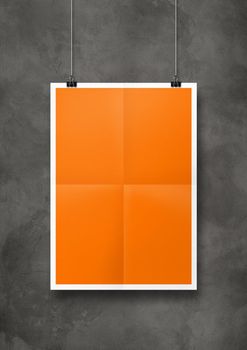 Orange folded poster hanging on a concrete wall with clips. Blank mockup template