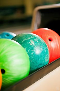 Bowling balls in a bowling alley ready to be used