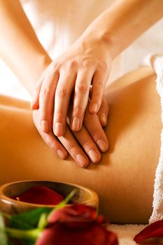 Woman enjoying a massage in a spa setting