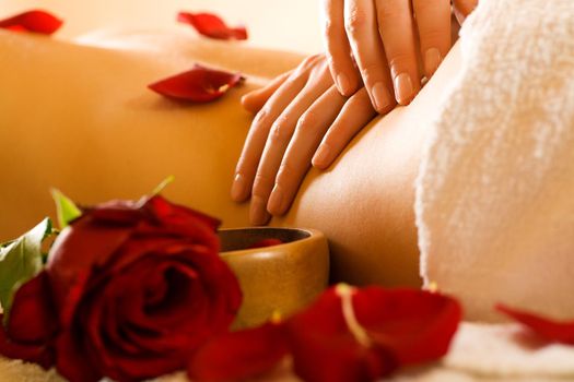 Woman enjoying a massage in a spa setting