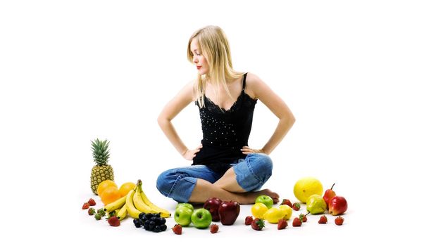 Food, fruit and healthy nutrition - lot of fresh fruit and a blond girl