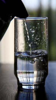 salvador, bahia / brazil - june 10, 2020: transparent glass cup is seen with water in the city of Salvador.