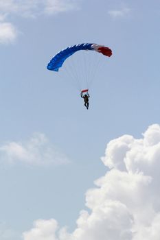 itaparica, bahia / brazil - august 18, 2012: person is seen during a parachute jump on the island of Itaparica.