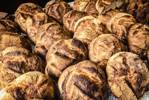 Loaves of traditional country bread out of the oven