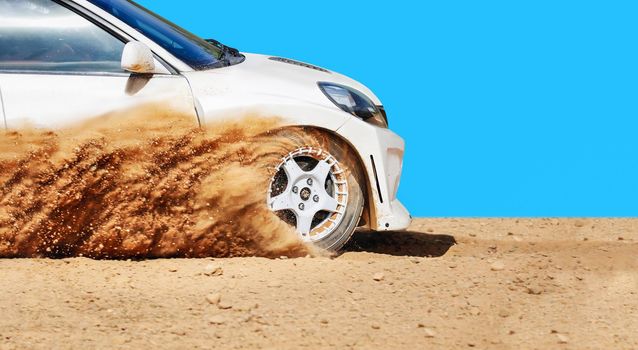 Rally racing car on dirt track.