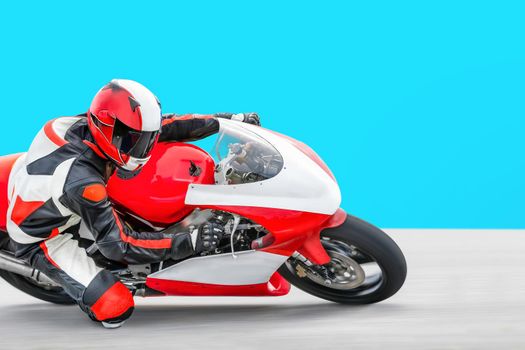 Motorcycle leaning into a fast corner on race track