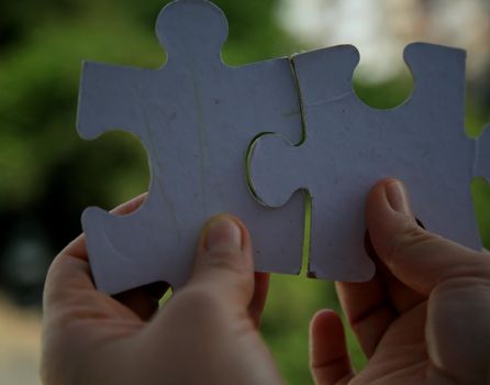 salvador, bahia / brazil - july 15, 2020: hand holds puzzle pieces in the city of Salvador.