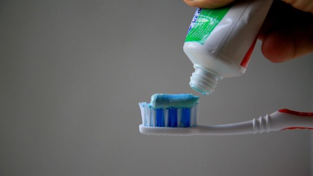 salvador, bahia / brazil - may 13, 2020: toothpaste is seen with a toothbrush in the city of Salvador.