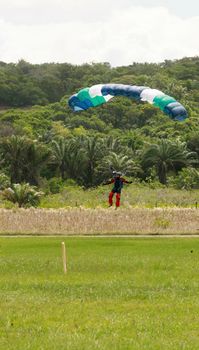 itaparica, bahia / brazil - august 18, 2012: person is seen during a parachute jump on the island of Itaparica.