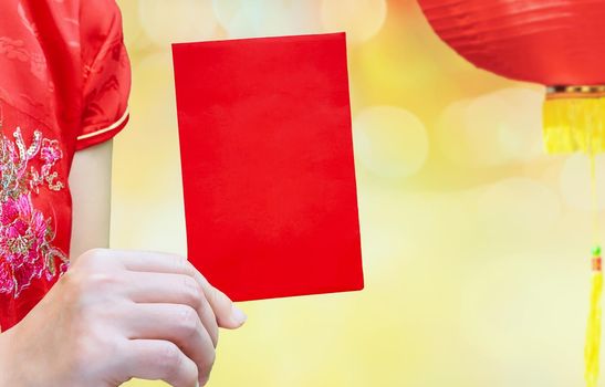 chinese woman holding new year red envelope or hong bao , text mean best whishes for you.