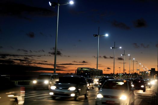 salvador, bahia / brazil - january 20, 2015: vehicles are seen passing through the Pituba neighborhood in the city of Salvador in a place with LED lighting on the road.