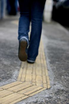 salvador, bahia / brazil - july 24, 2014: Sidewalk with tactile floor used for guidance for the visually impaired is seen in the Pituba neighborhood of Salvador.

