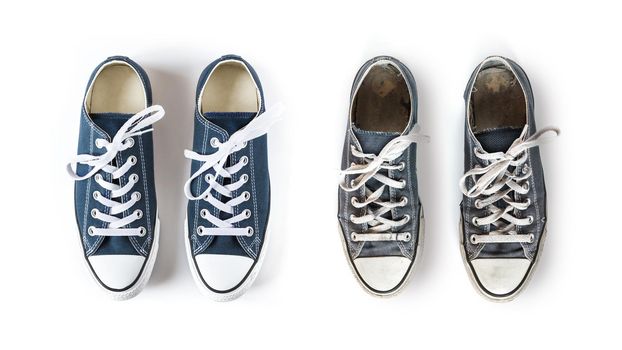 New and old blue generic sneakers isolated on white background