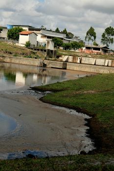 eunapolis, bahia / brazil - october 21, 2008: industrial waste water pond is seen in the city of Eunapolis, in southern Bahia.


