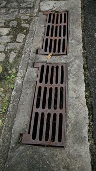 salvador, bahia / brazil - june 27, 2020: manhole grating for rainwater drainage is seen in a condominium in the city of Salvador.