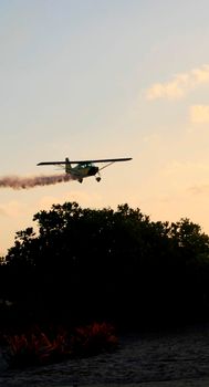 porto seguro, bahia / brazil - october 25, 2008: Small aircraft is seen during maneuvers at an air show with experimental aircraft in the city of Porto Seguro.

 