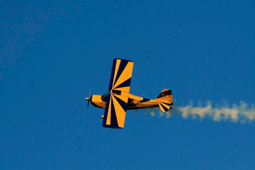 porto seguro, bahia / brazil - october 25, 2008: Small aircraft is seen during maneuvers at an air show with experimental aircraft in the city of Porto Seguro.

 