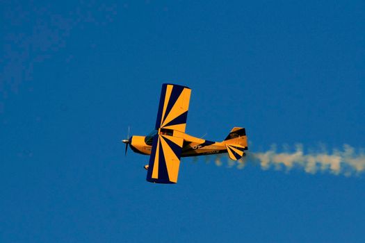 porto seguro, bahia / brazil - october 25, 2008: Small aircraft is seen during maneuvers at an air show with experimental aircraft in the city of Porto Seguro.

 