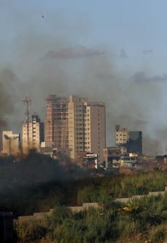 itabuna, bahia / brazil - march 29, 2012: Smoke from burning vegetation is seen in the city of Itabuna.
