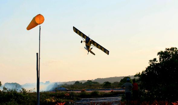 porto seguro, bahia / brazil - october 25, 2008: Small aircraft is seen during maneuvers at an air show with experimental aircraft in the city of Porto Seguro.

 