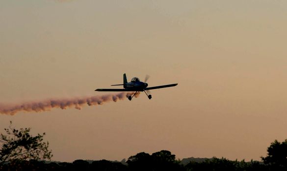 porto seguro, bahia / brazil - october 25, 2008: Small aircraft is seen during maneuvers at an air show with experimental aircraft in the city of Porto Seguro.

 