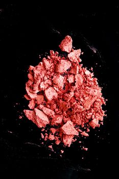 Crushed cosmetics, mineral organic eyeshadow, blush and cosmetic powder isolated on black background, makeup and beauty banner, flatlay design.