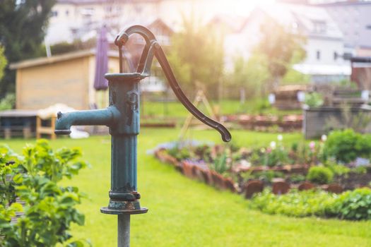 Close up of well for watering urban gardening vegetable patches.