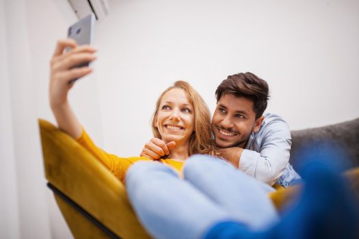 couple in love taking selfie and smiling