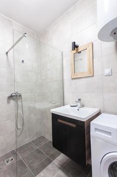 modern toilet interior with glass shower