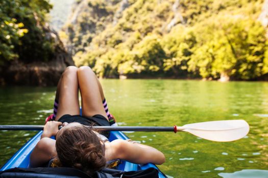 young active girl enjoying a kayak ride