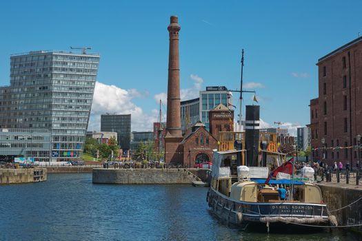 LIVERPOOL, ENGLAND, UK - JUNE 07, 2017: View of Albert Dock in Liverpool, England. The Albert Dock is a complex of dock buildings and warehouses. First non-combustible warehouse system in the world.