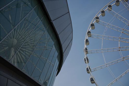 LIVERPOOL, ENGLAND, UK - JUNE 07, 2017: View of the ECHO convention center and an adjacent ferris wheel in Liverpool, England