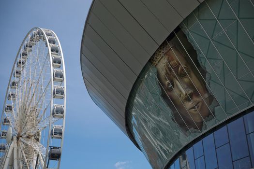 LIVERPOOL, ENGLAND, UK - JUNE 07, 2017: View of the ECHO convention center and an adjacent ferris wheel in Liverpool, England